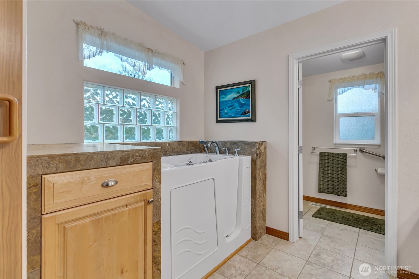 24319 68th Street East, Unit 84 Buckley, WA 98321 - Photo 22 of 40 a view of washer and dryer with bathroom in the background