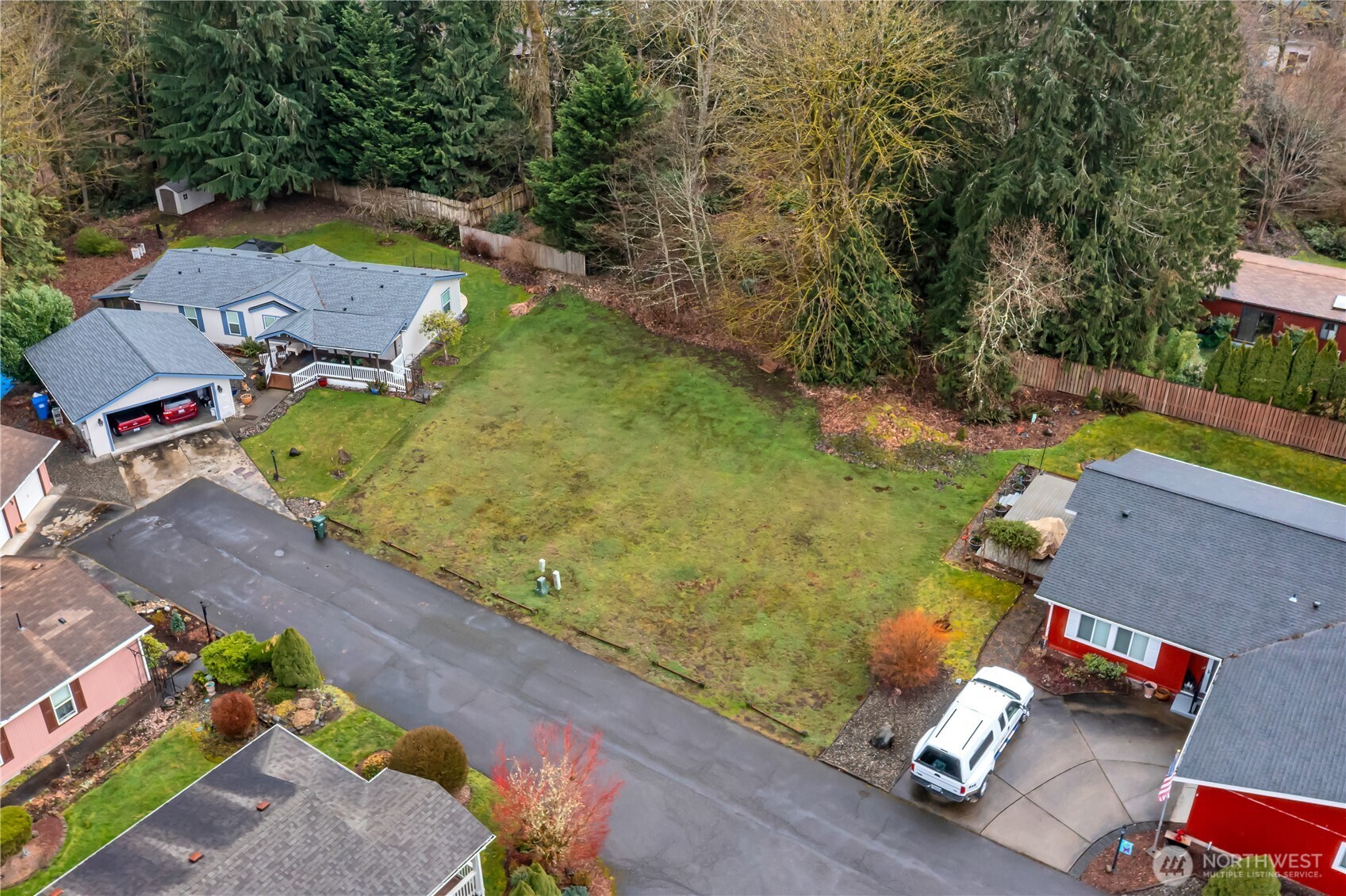 24319 68th Street East, Unit 84 Buckley, WA 98321 - Photo 39 of 40 an aerial view of a houses with yard