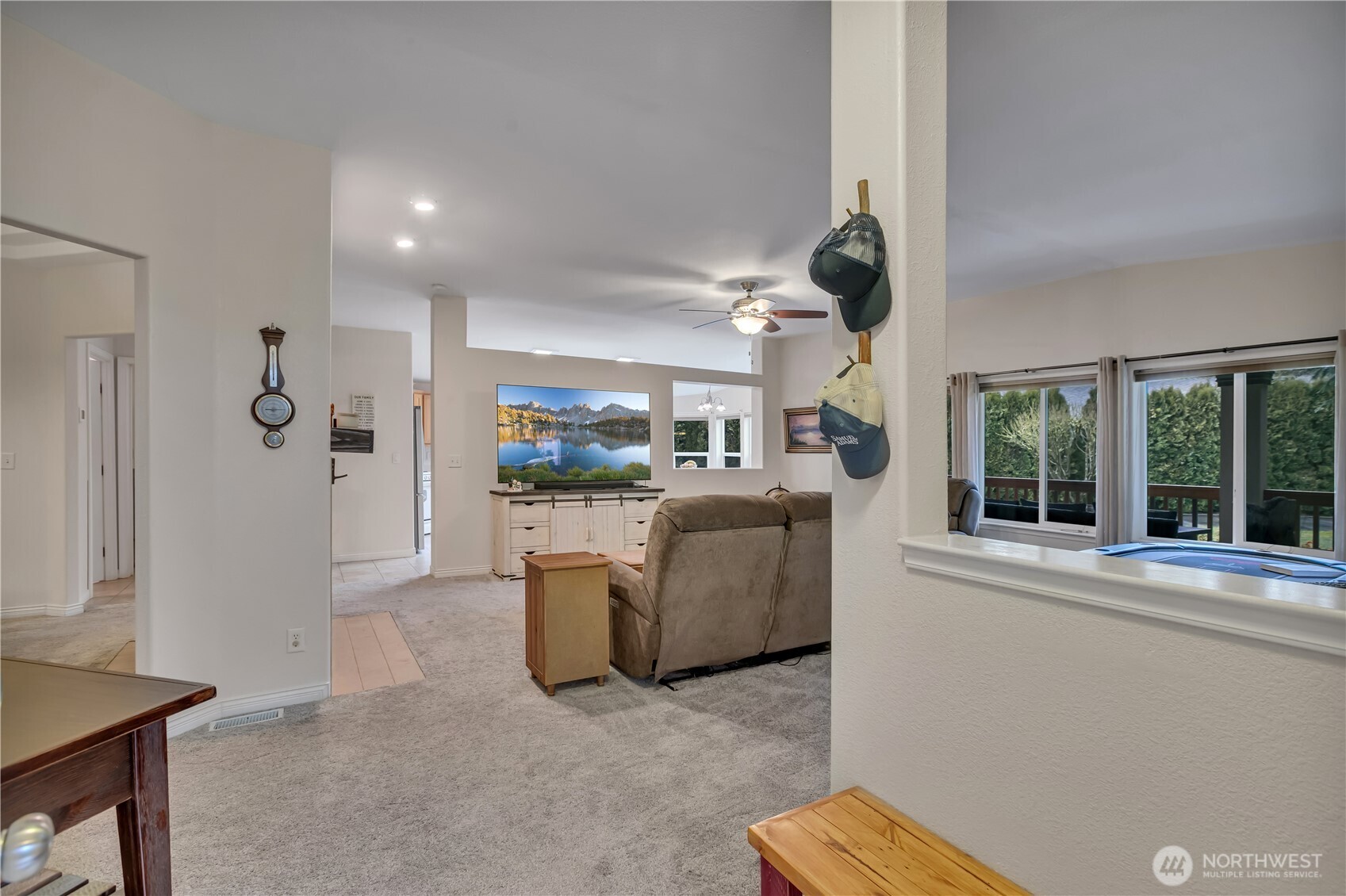24319 68th Street East, Unit 84 Buckley, WA 98321 - Photo 7 of 40 a living room with furniture and a large window