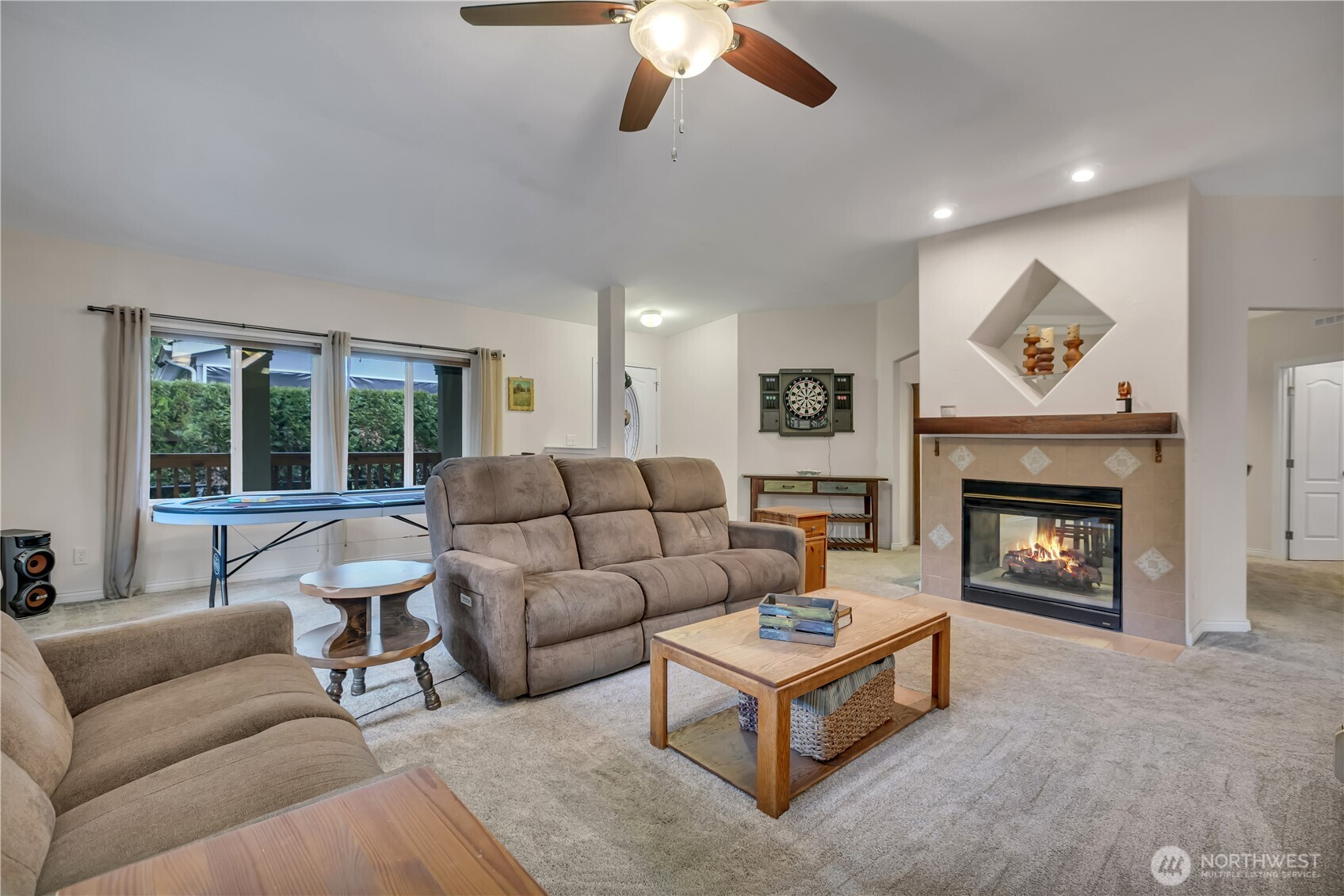 24319 68th Street East, Unit 84 Buckley, WA 98321 - Photo 9 of 40 a living room with furniture and a fireplace