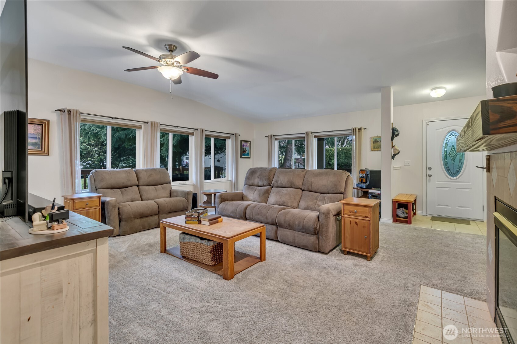 24319 68th Street East, Unit 84 Buckley, WA 98321 - Photo 10 of 40 a living room with furniture and a flat screen tv