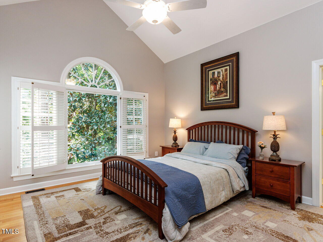 4613 Wee Burn Trail Raleigh, NC 27612 - Photo 22 of 49 Stunning Primary with vaulted ceiling, large window with 3" plantation shutters with a view, hardwood flooring