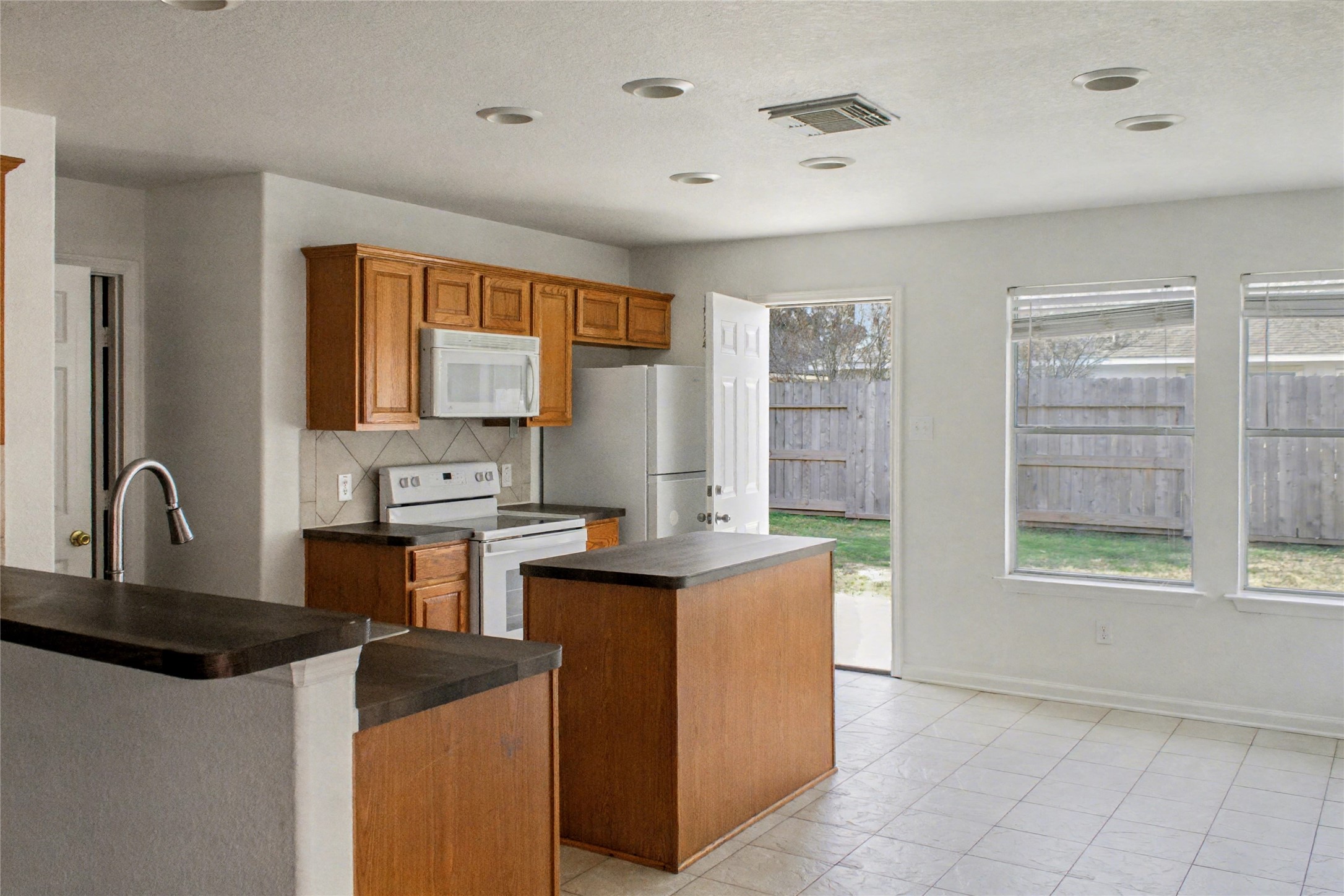 3314 Falcon Trail Drive Spring, TX 77373 - Photo 5 of 10 a kitchen with stainless steel appliances granite countertop a sink stove and refrigerator