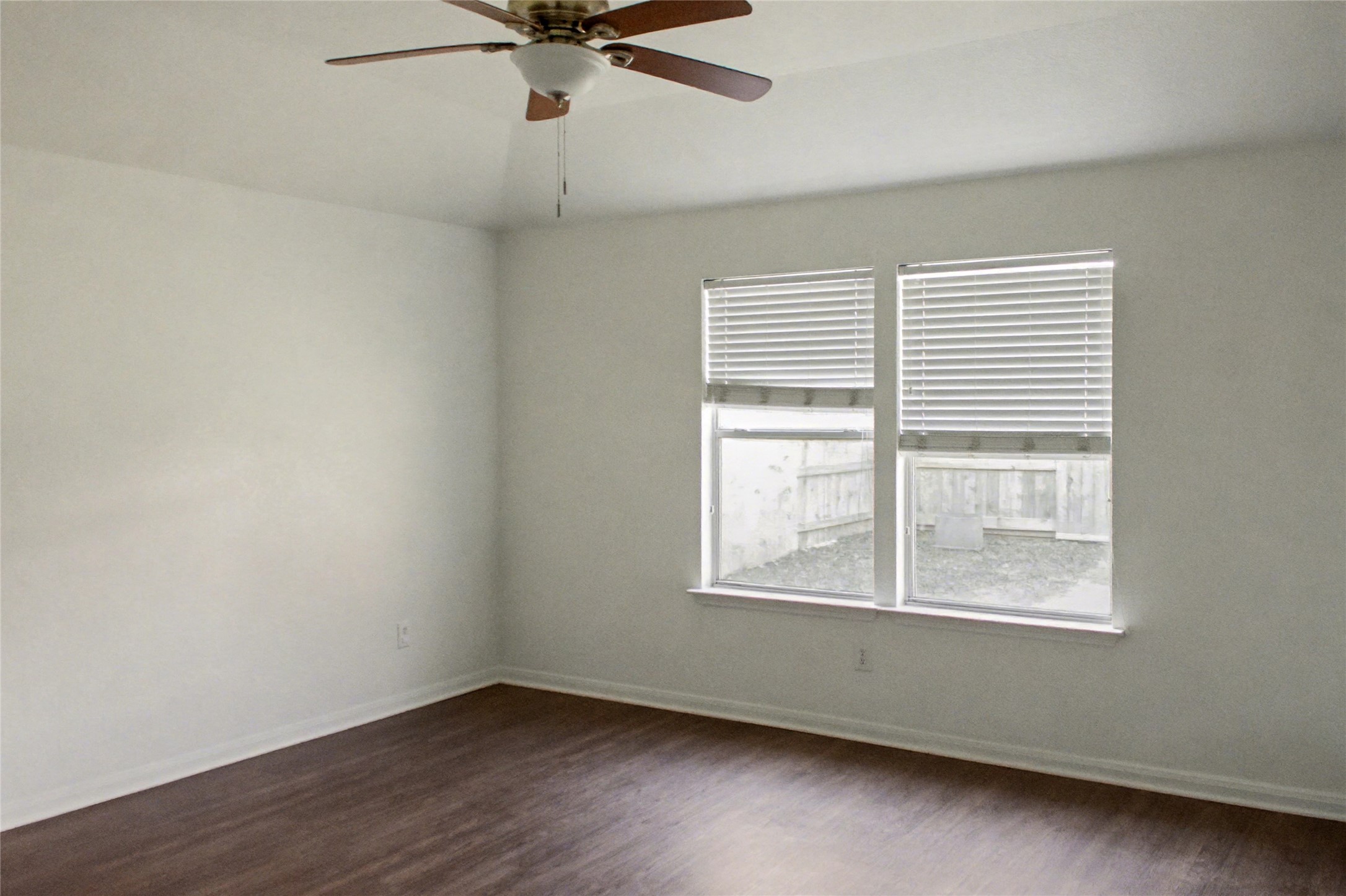 3314 Falcon Trail Drive Spring, TX 77373 - Photo 6 of 10 an empty room with a window and a fan
