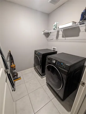 a utility room with dryer and washer