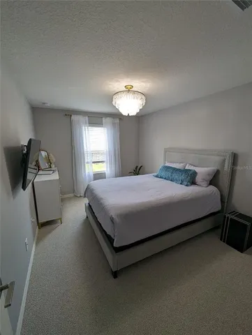 a bedroom with a bed and furniture