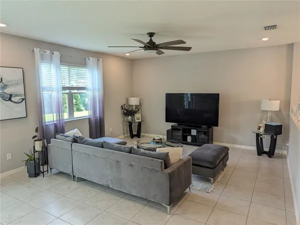 a kitchen with stainless steel appliances granite countertop a stove microwave and cabinets