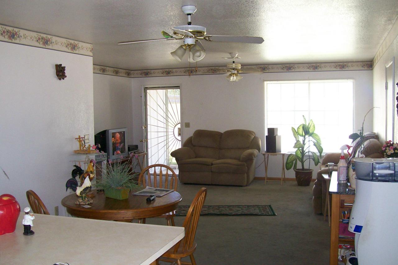 3607 Santa Rosa Way Redding, CA 96003 - Photo 4 of 10 a living room with furniture and a chandelier