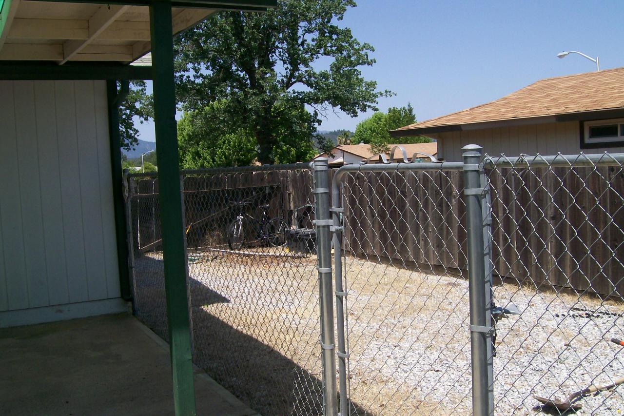 3607 Santa Rosa Way Redding, CA 96003 - Photo 7 of 10 a view of a wooden fence