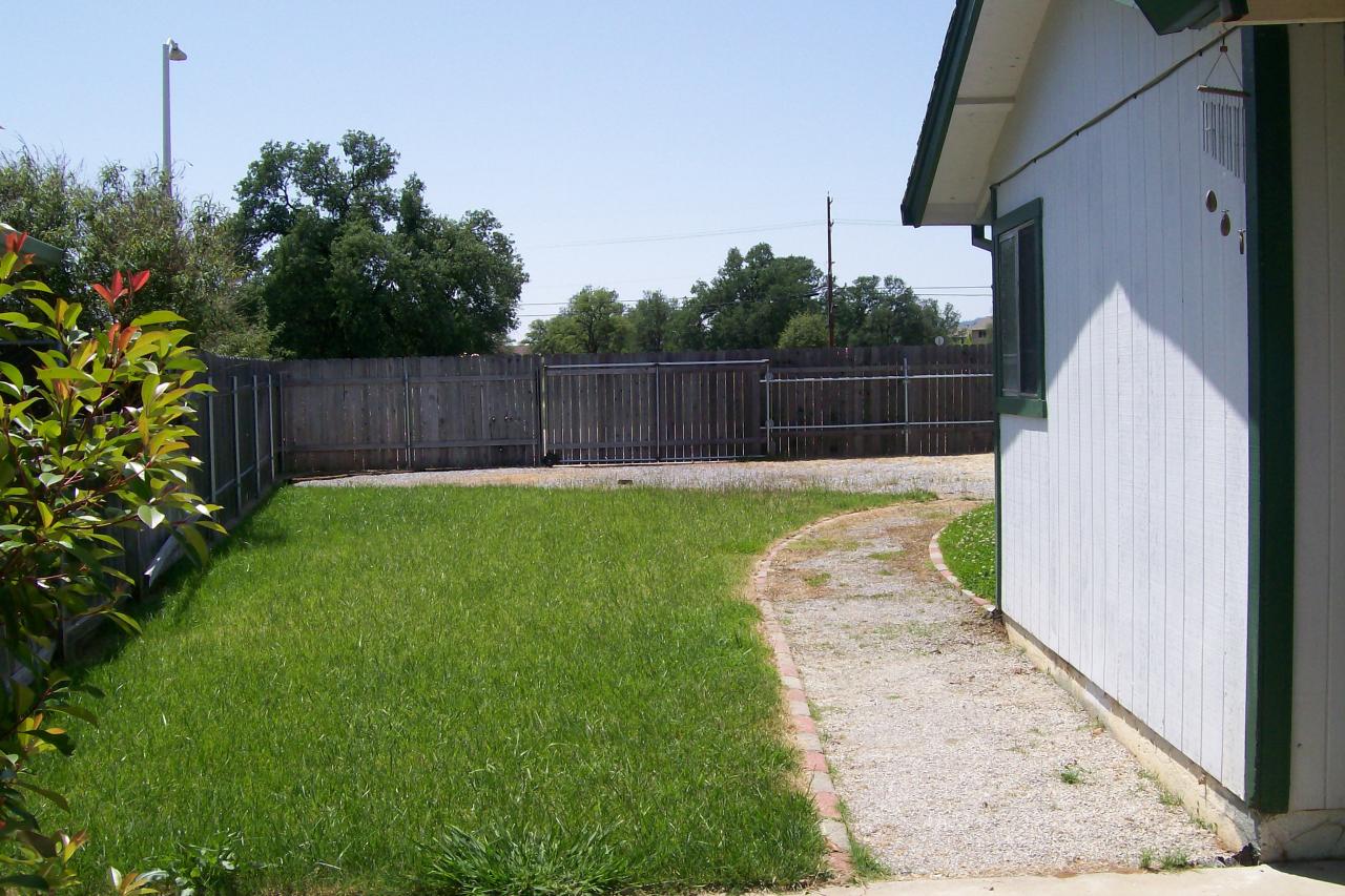 3607 Santa Rosa Way Redding, CA 96003 - Photo 10 of 10 a view of a backyard with potted plants
