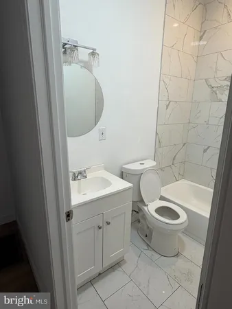 a bathroom with a toilet and a sink