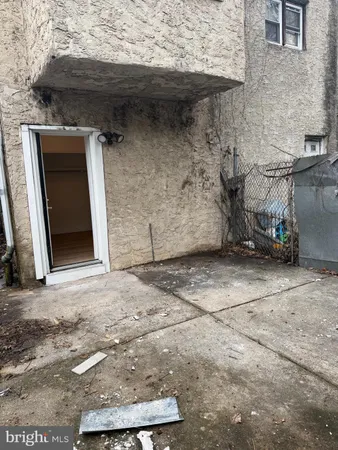 a view of a wooden door and a window