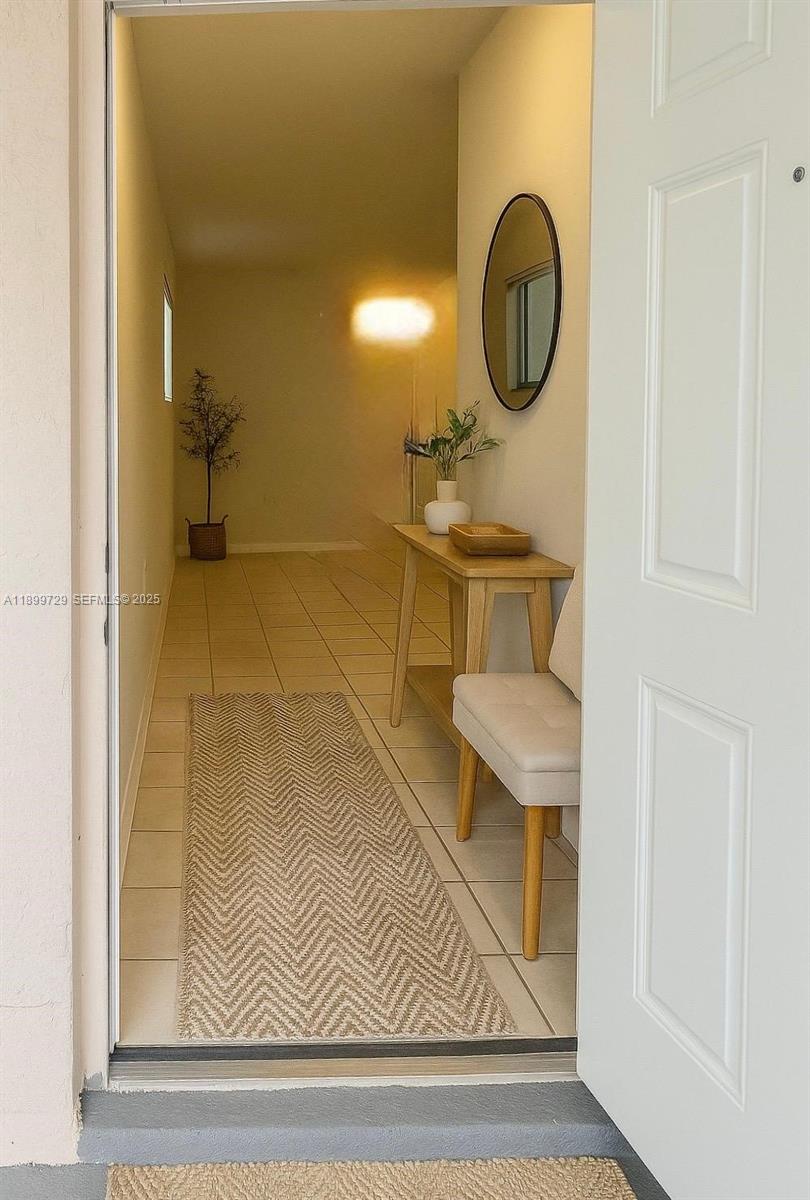 1270 Southeast 28th Court, Unit 101 Homestead, FL 33035 - Photo 11 of 27 a bathroom with a sink and a mirror