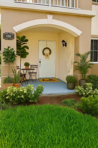 a front view of a house with garden