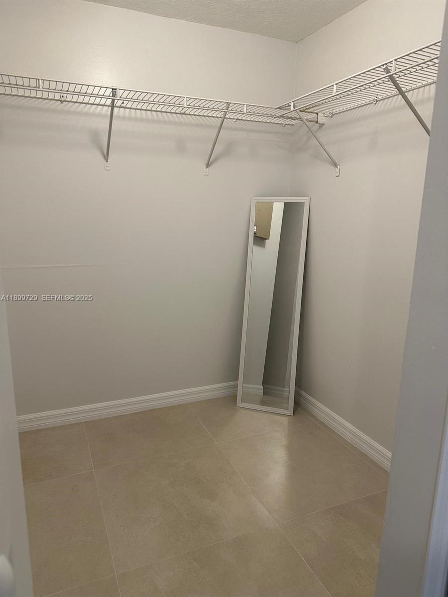 1270 Southeast 28th Court, Unit 101 Homestead, FL 33035 - Photo 21 of 27 a view of a room with racks on the wall