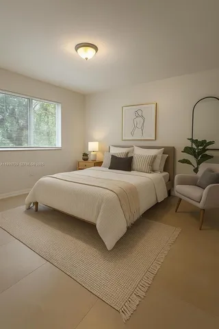 a bedroom with bed and a window