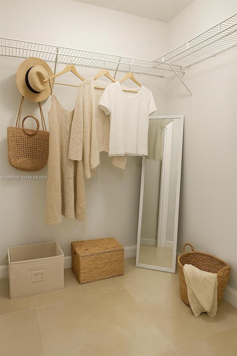 1270 Southeast 28th Court, Unit 101 Homestead, FL 33035 - Photo 5 of 27 a bathroom with a sink and mirror