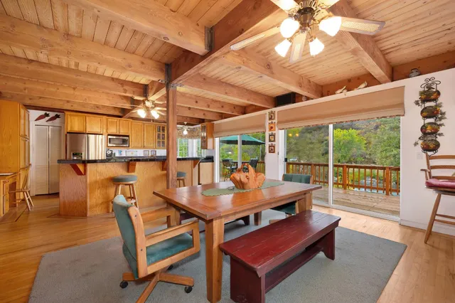 a kitchen with stainless steel appliances granite countertop a stove and a wooden cabinets