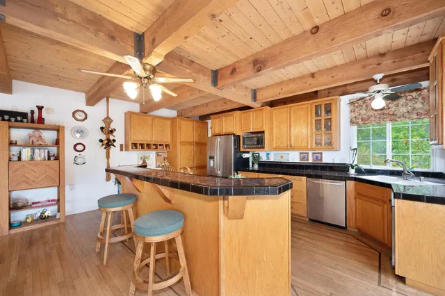 a room with lots of furniture and a large window