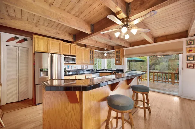 a bedroom with bed couch and window