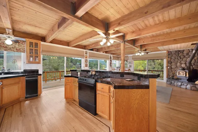 a bedroom with furniture and a large window