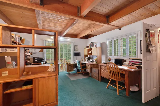 a view of an entryway wooden floor and a chandelier fan