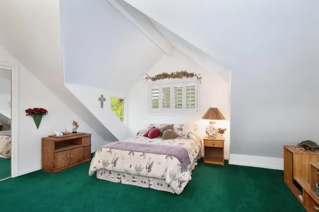 a view of a dinning table and chairs in patio of the house