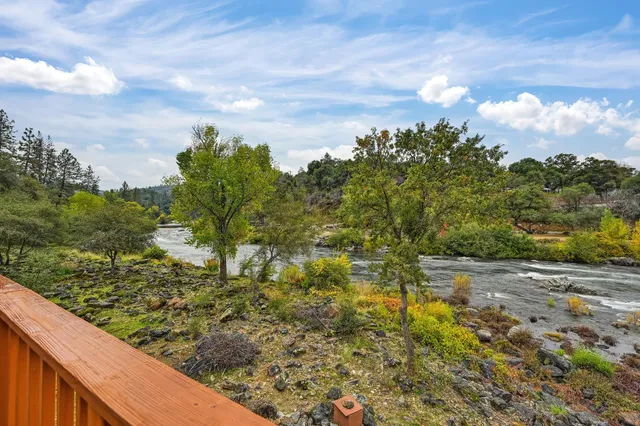 a view of swimming pool with a yard and sitting area