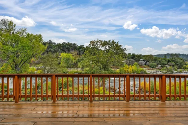 a view of a large building with a tree