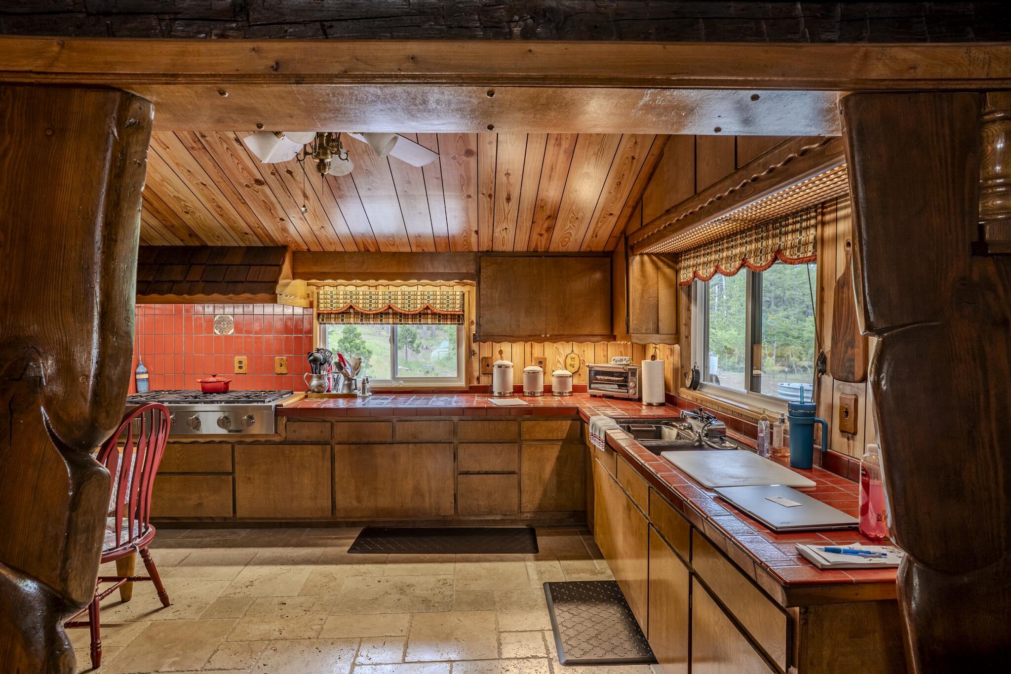 1969 Colestin Road Ashland, OR 97520 - Photo 30 of 72 a kitchen with stainless steel appliances granite countertop a stove a sink and a microwave