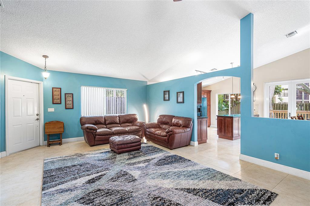 1443 Banyan Circle Pompano Beach, FL 33069 - Photo 14 of 36 a living room with furniture and a couch