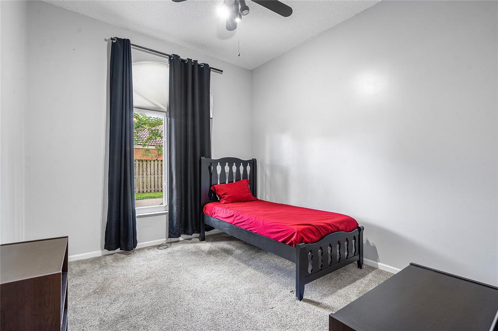 1443 Banyan Circle Pompano Beach, FL 33069 - Photo 16 of 36 a bedroom with a bed and a window