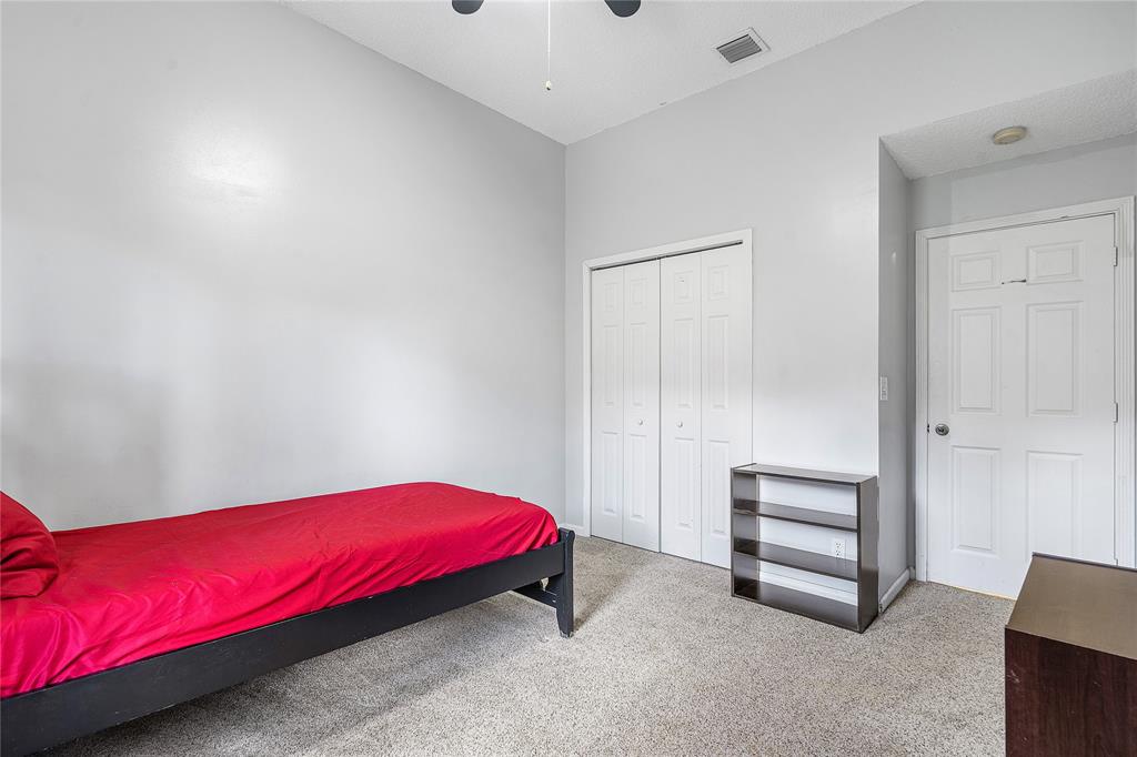 1443 Banyan Circle Pompano Beach, FL 33069 - Photo 17 of 36 a bedroom with a bed and a table