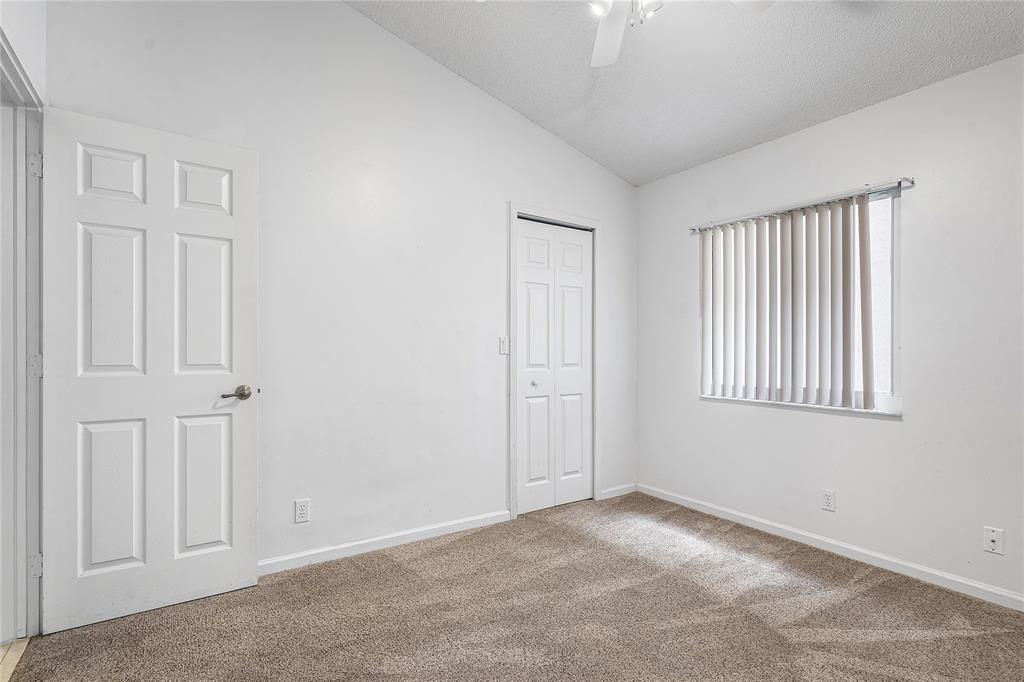 1443 Banyan Circle Pompano Beach, FL 33069 - Photo 20 of 36 a view of an empty room with a window