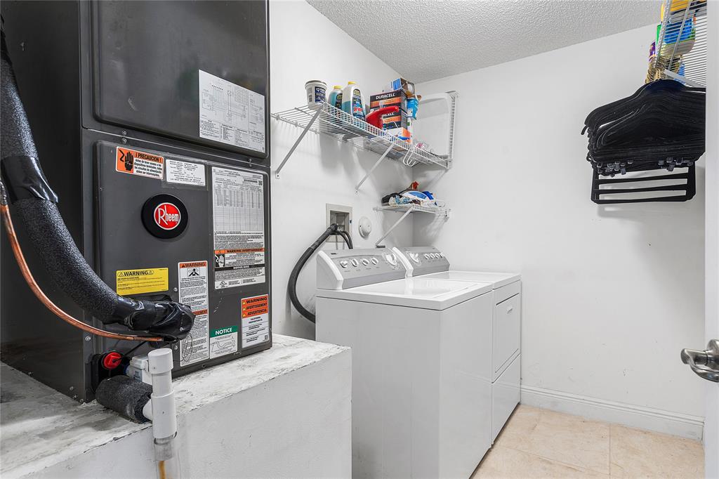 1443 Banyan Circle Pompano Beach, FL 33069 - Photo 21 of 36 a view of washer and dryer