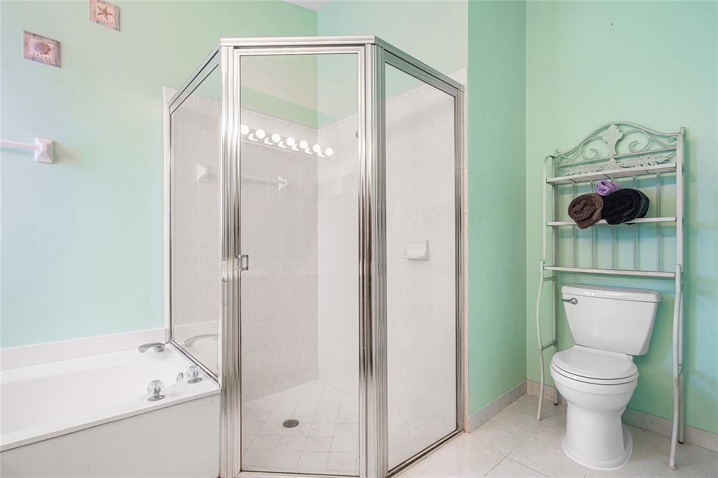 1443 Banyan Circle Pompano Beach, FL 33069 - Photo 26 of 36 a bathroom with a toilet and a shower