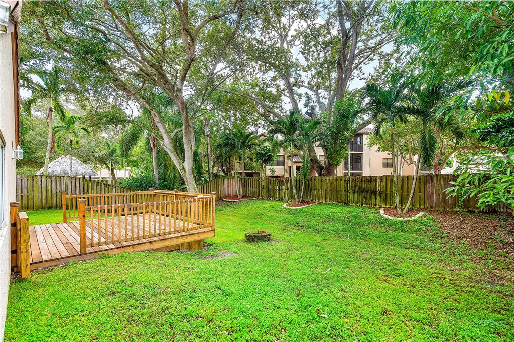 1443 Banyan Circle Pompano Beach, FL 33069 - Photo 33 of 36 a view of a backyard with a small cabin