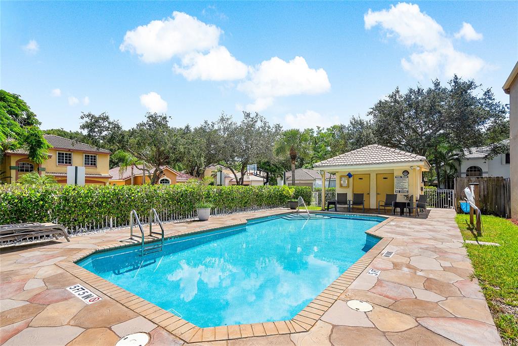 1443 Banyan Circle Pompano Beach, FL 33069 - Photo 35 of 36 a view of a house with swimming pool and sitting area