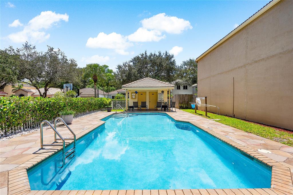1443 Banyan Circle Pompano Beach, FL 33069 - Photo 36 of 36 a house view with a swimming pool and sitting space