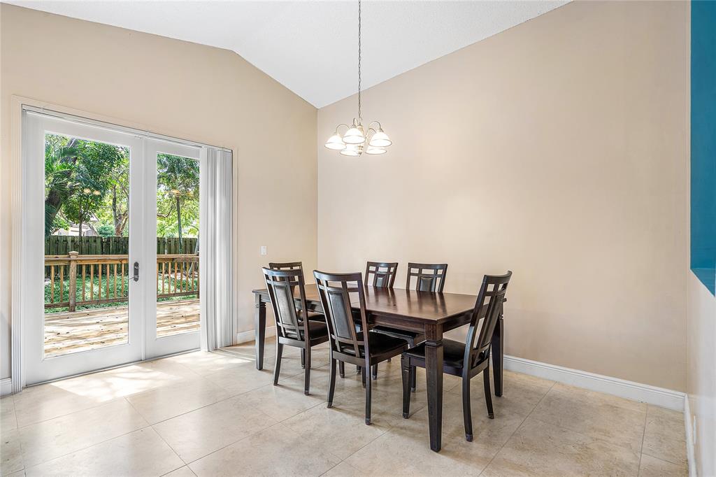 1443 Banyan Circle Pompano Beach, FL 33069 - Photo 9 of 36 a view of a dining room with furniture window and outside view