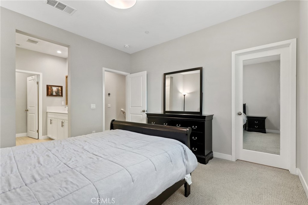 649 West Foothill Boulevard, Unit 2 Glendora, CA 91741 - Photo 16 of 44 a bedroom with a bed and a closet