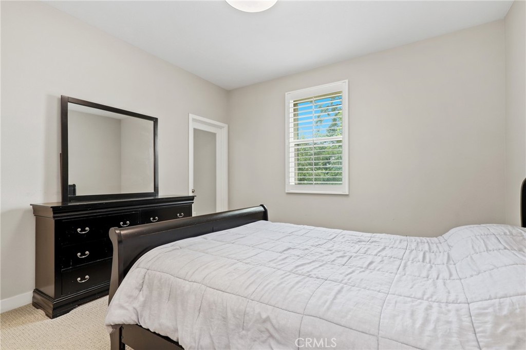 649 West Foothill Boulevard, Unit 2 Glendora, CA 91741 - Photo 18 of 44 a bedroom with a bed and a window