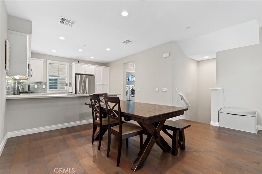 649 West Foothill Boulevard, Unit 2 Glendora, CA 91741 - Photo 7 of 44 a view of a dining room with furniture and wooden floor