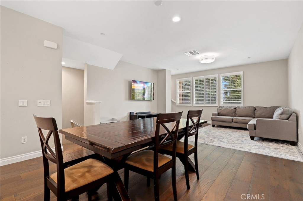 649 West Foothill Boulevard, Unit 2 Glendora, CA 91741 - Photo 9 of 44 a view of a dining room with furniture and wooden floor