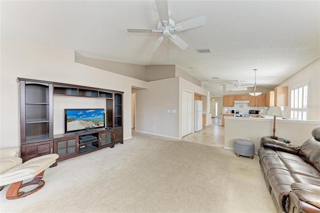 4642 Runabout Way Bradenton, FL 34203 - Photo 23 of 66 a living room with furniture and a flat screen tv