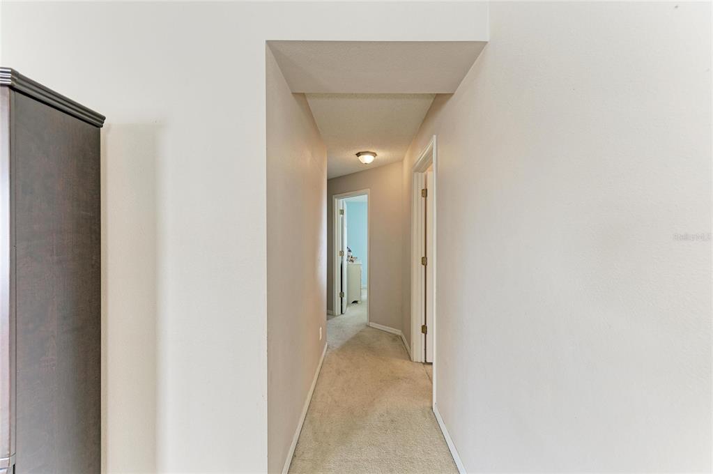 4642 Runabout Way Bradenton, FL 34203 - Photo 25 of 66 a view of a hallway with wooden floor