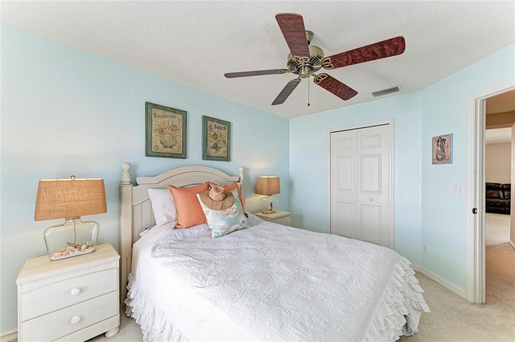 4642 Runabout Way Bradenton, FL 34203 - Photo 33 of 66 a bedroom with a bed and a painting on the wall