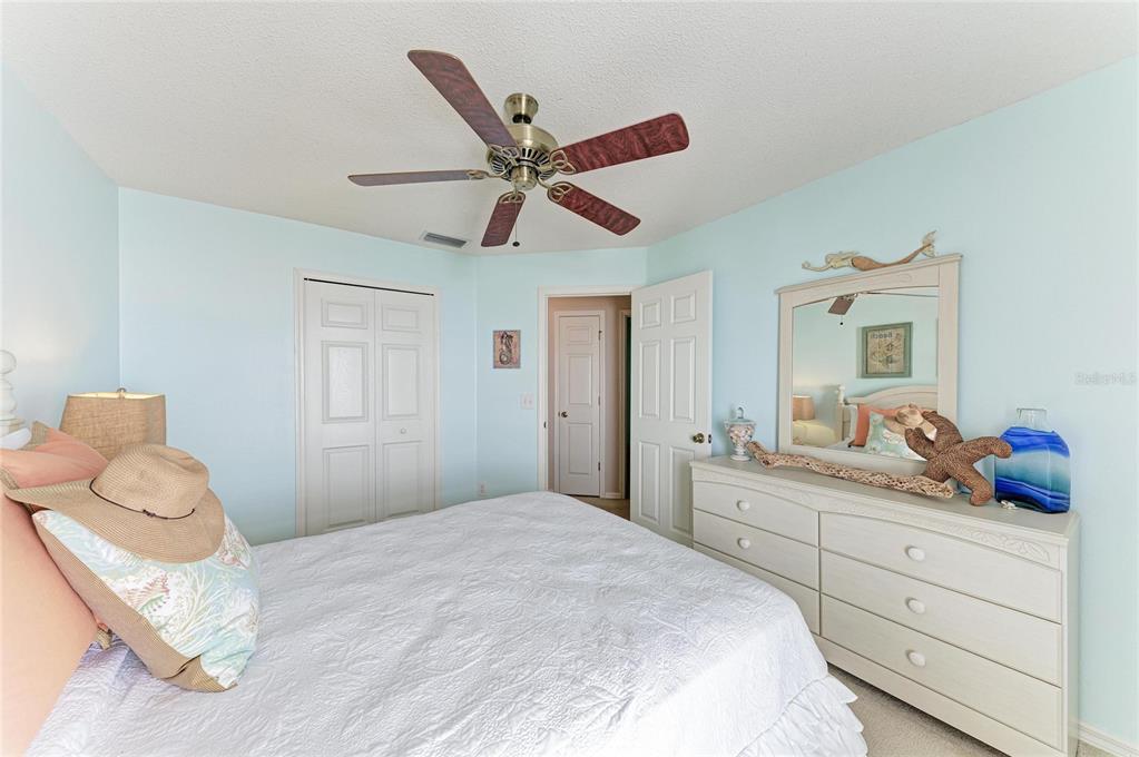 4642 Runabout Way Bradenton, FL 34203 - Photo 34 of 66 a bedroom with a bed and a dresser