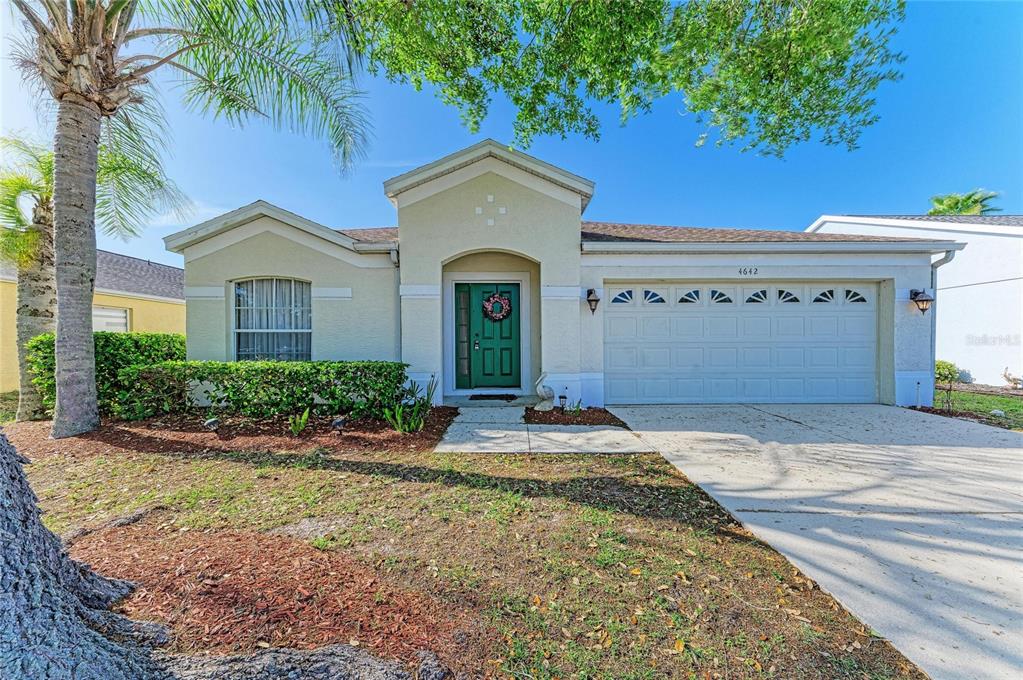 4642 Runabout Way Bradenton, FL 34203 - Photo 6 of 66 a front view of a house with garden