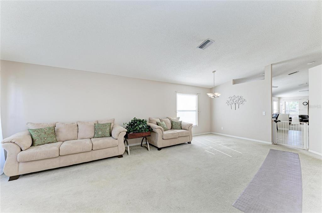 4642 Runabout Way Bradenton, FL 34203 - Photo 8 of 66 a living room with furniture and a couch
